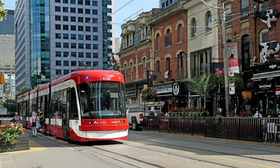 Toronto Flexity Outlook streetcar on a clear daytime street