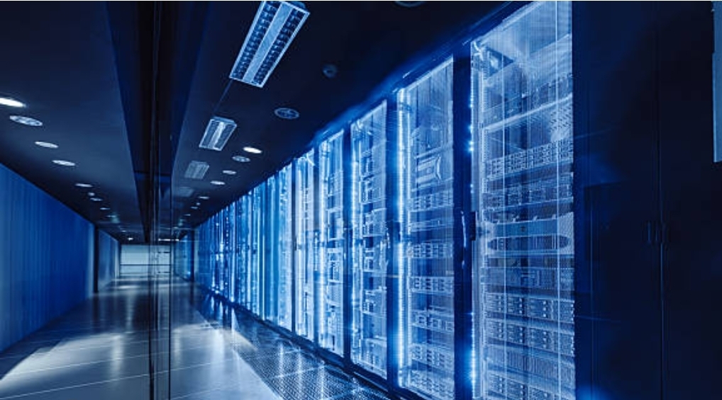 Server aisle inside a data centre, blue lighting