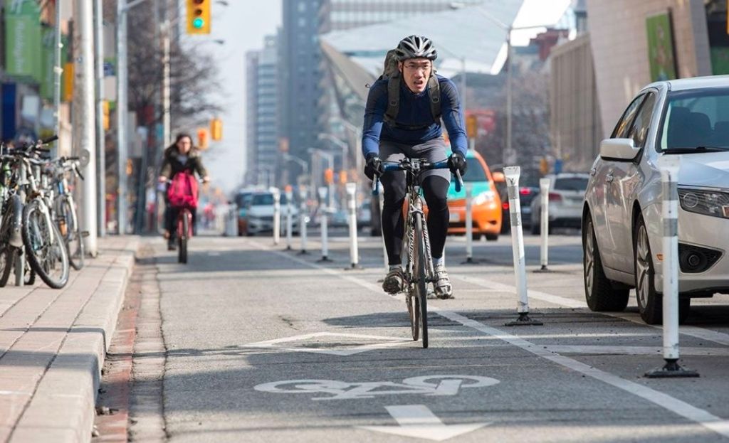 Cyclist riding in a separated protected bike lane