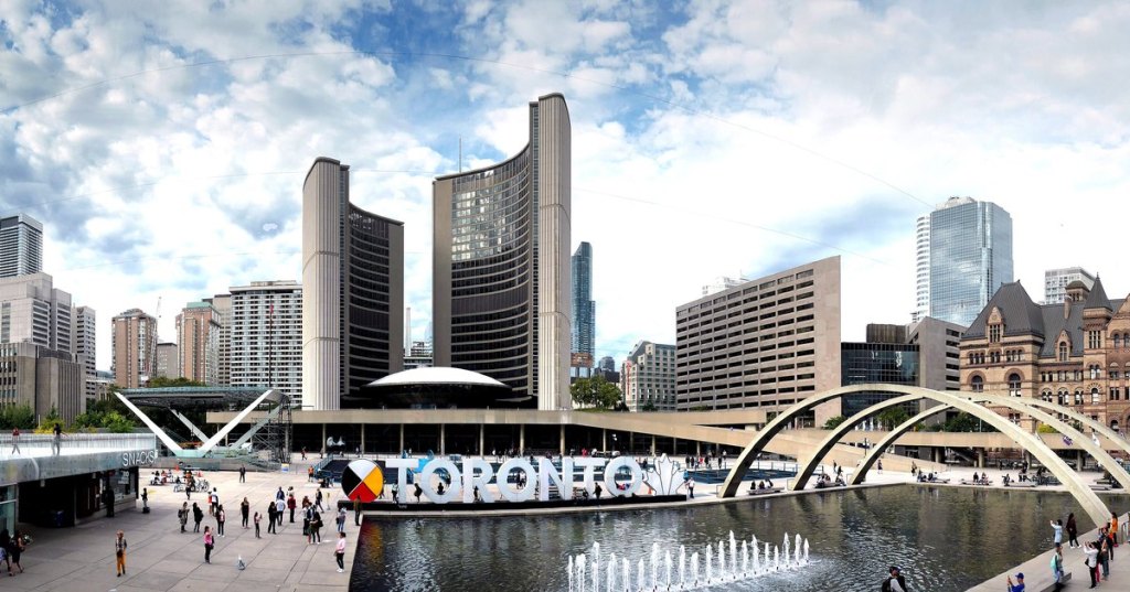 Toronto City Hall and Nathan Phillips Square, with the Toronto sign and reflecting pool