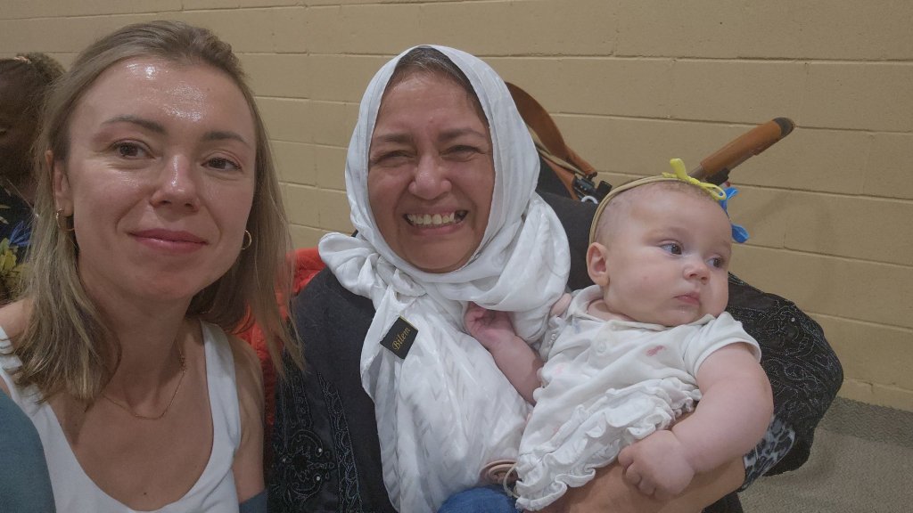 Bahira Abdulsalam holds a baby at a community event in Toronto