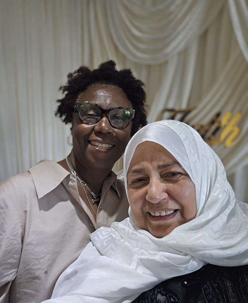 Bahira Abdulsalam smiles with a supporter at a community celebration in Toronto